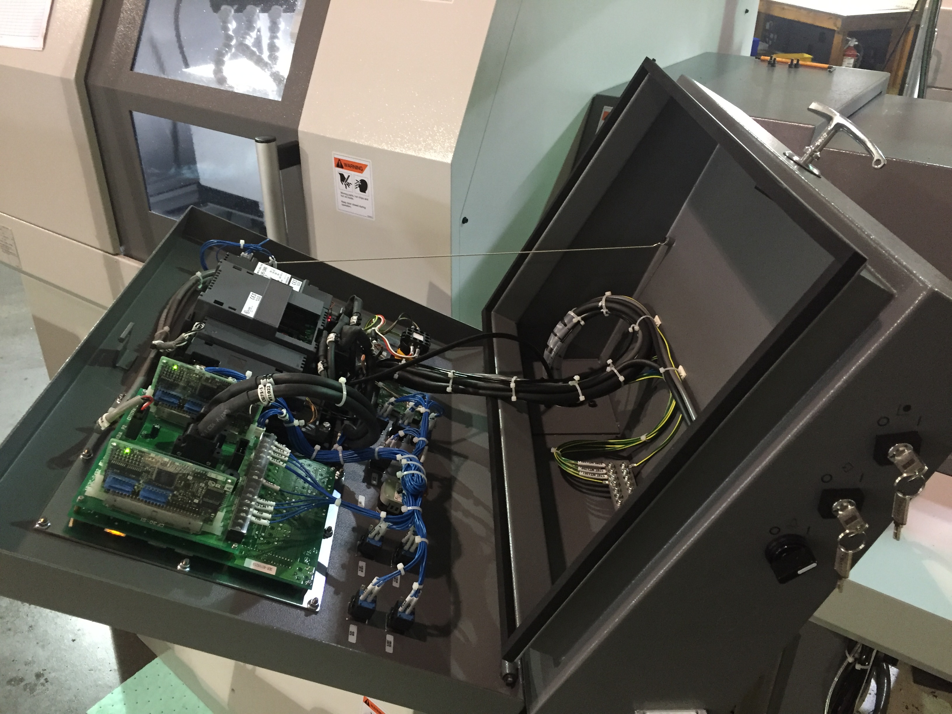 Citizen Cincom L20A electrical cabinet interior — circuit boards and wiring visible