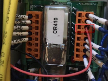 Press brake electrical cabinet — CR410 relay board with orange terminal highlighted in red; this terminal carries the Ram Down signal and is where the I/O module wire connects
